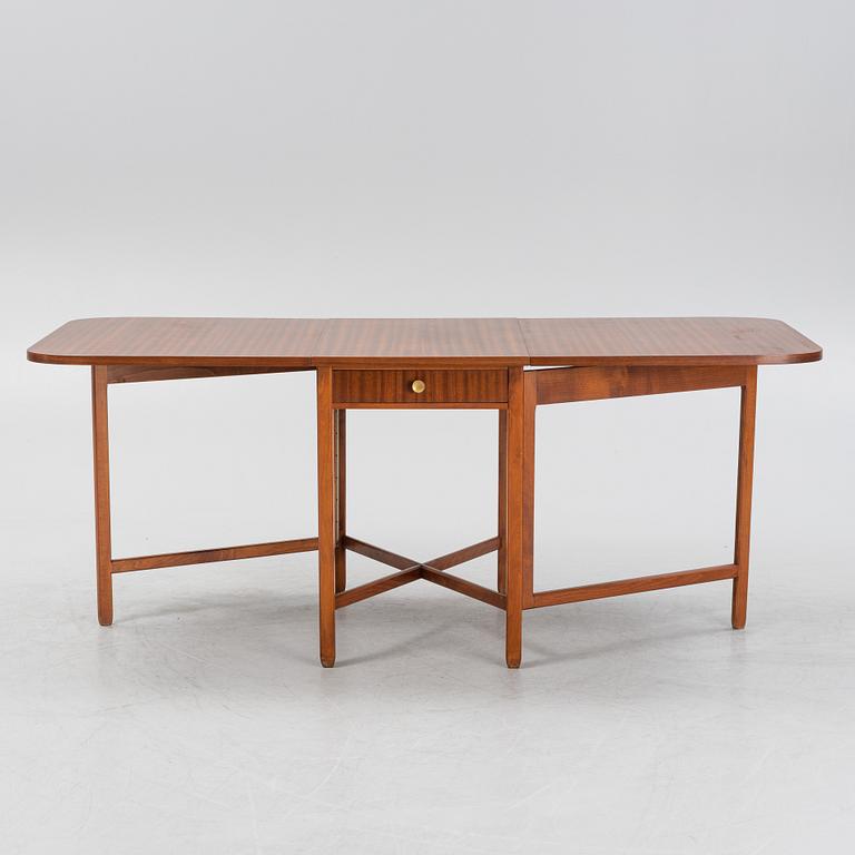 A mahogany veneered gate-leg table, second half of the 20th Century.