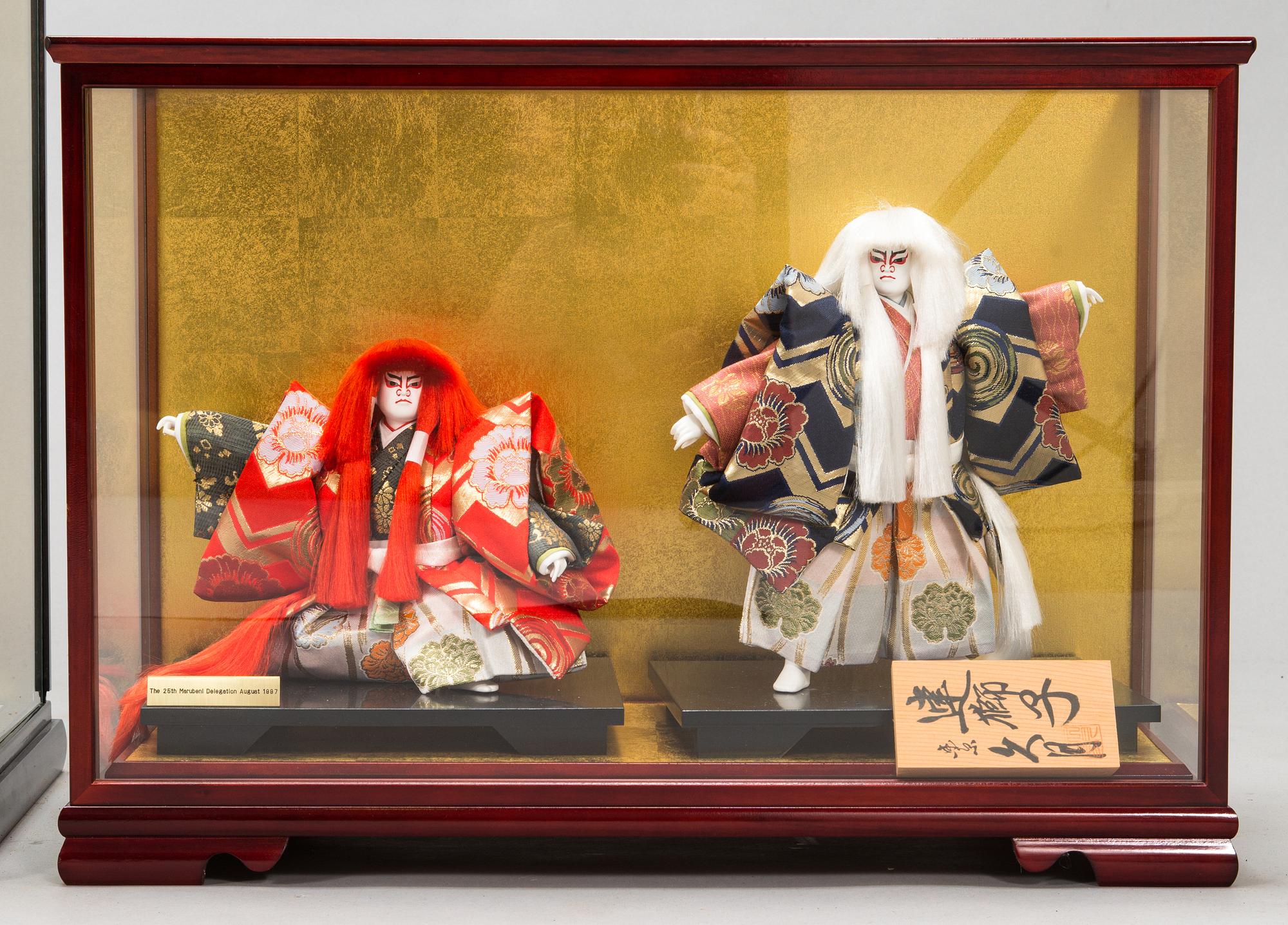 Four late 20th century Japanese dolls.