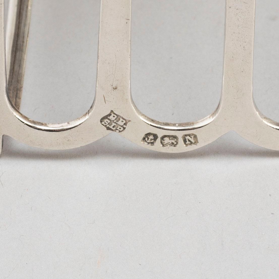 a set of four silver toastracks, Barker Brothers Birmingham 1936.