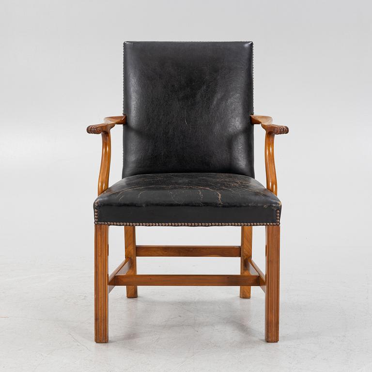 A leather upholstered armchair, 20th Century.
