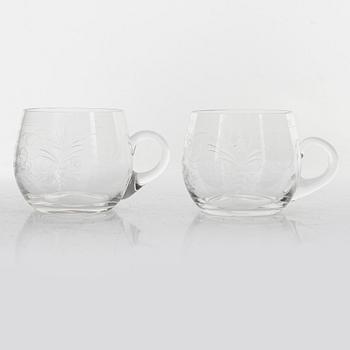 A punch bowl and mugs, glass, mid 20th century.