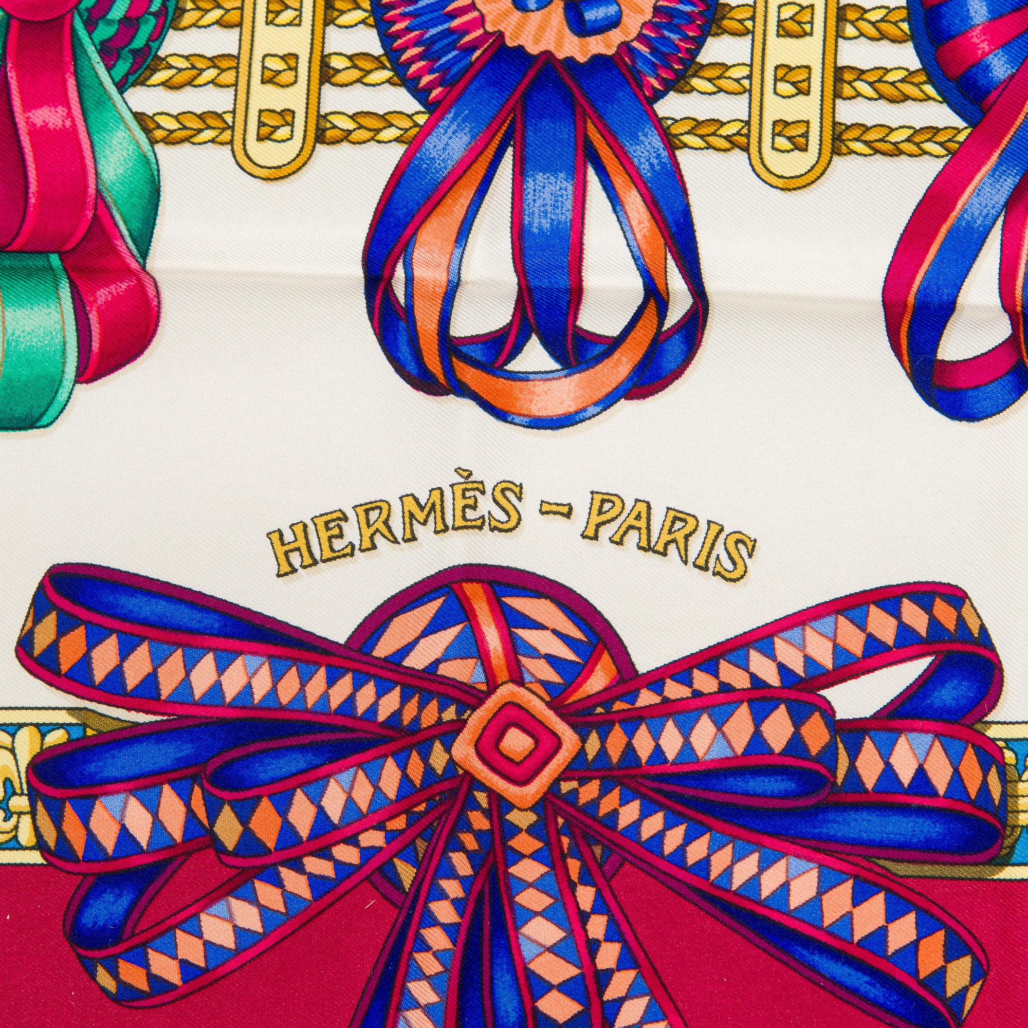 Hermès, a 'Les Rubans du Cheval' silk scarf.