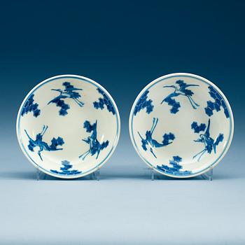 1939. A pair of Japanese blue and white crane dishes, presumably 19th Century.