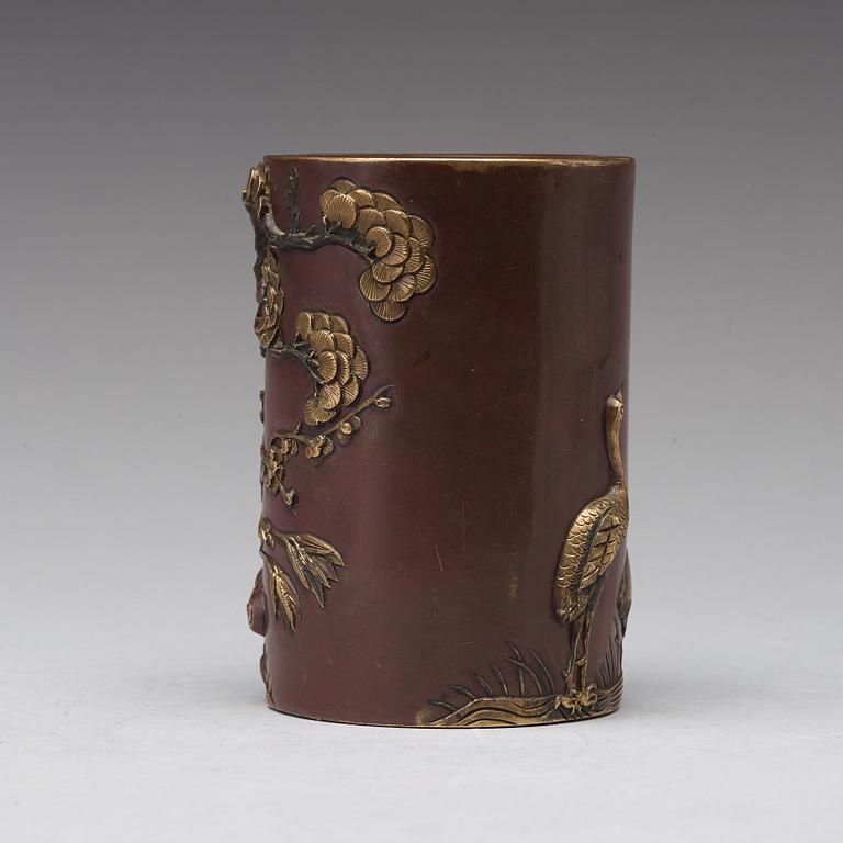 A bronze brush pot, Qing dynasty, with Qianlong seal mark to base.