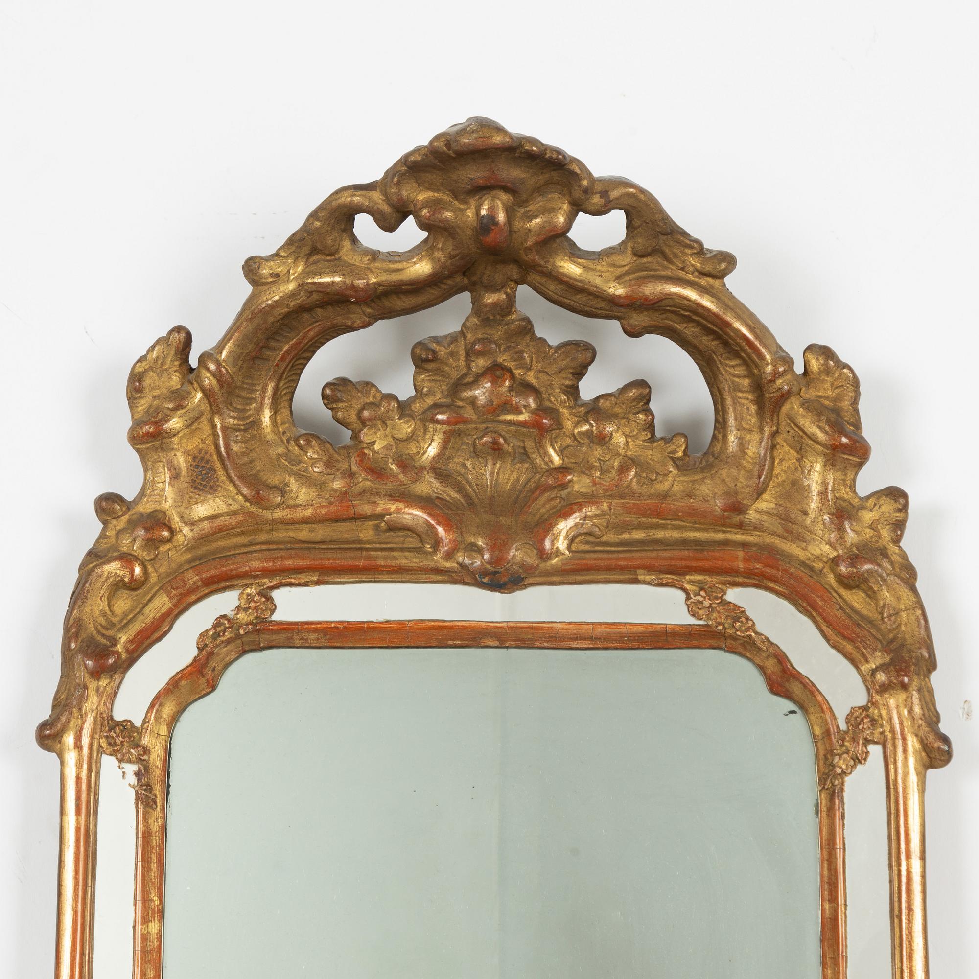 A pair of Swedish rococo two-light girandole mirrors, later part 18th century.