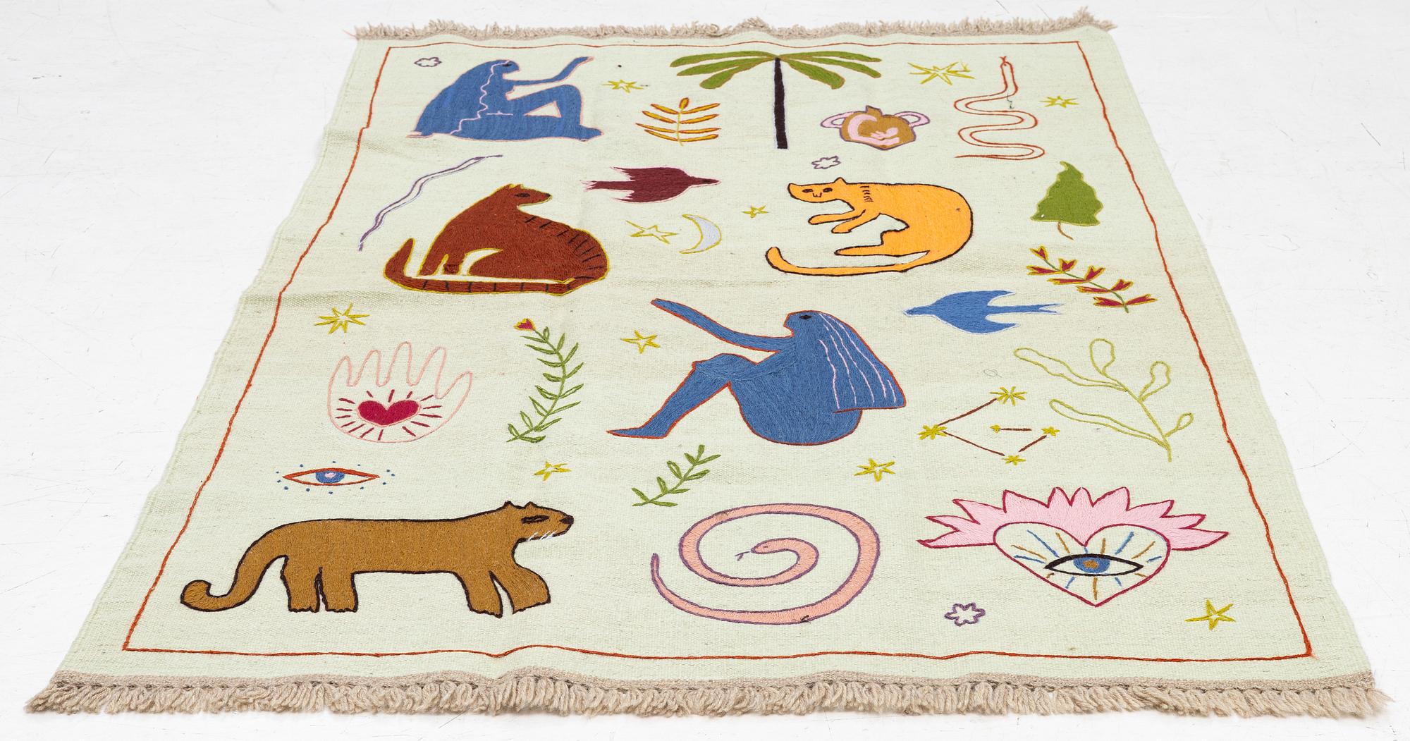 A hand-embroidered kilim rug, c. 186 x 125 cm.