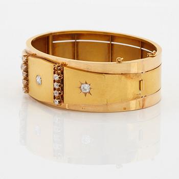 An 18K gold bracelet set with old-cut diamonds.