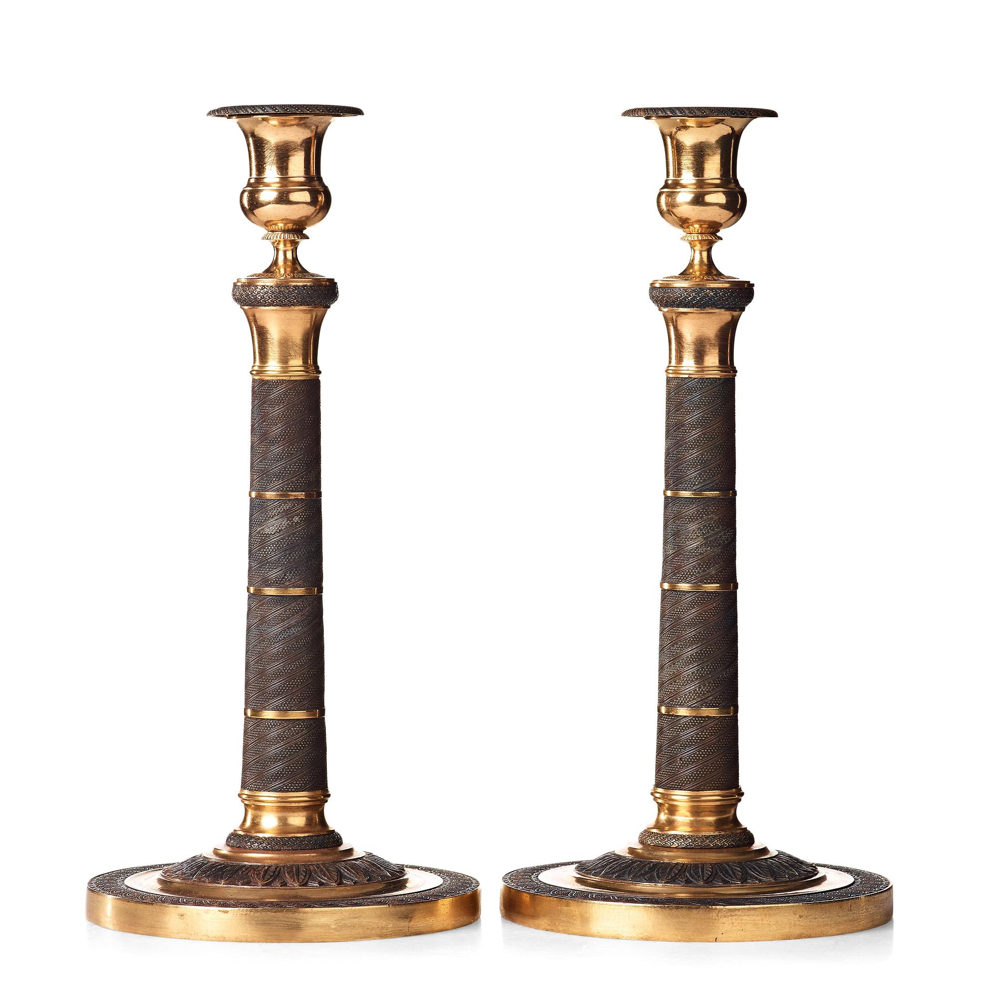 A pair of French Empire early 19th century candlesticks.