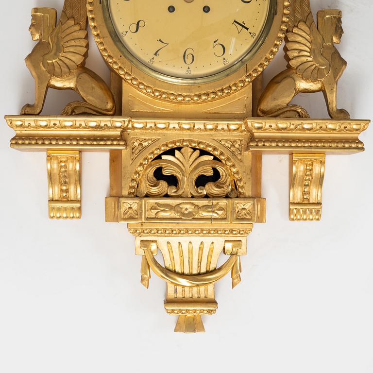 An Empire style wall clock, mid 20th century.