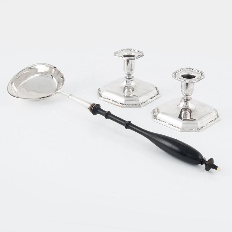 A Swedish Silver Ladle, mark of Adolf Öström, Piteå 1887 and a pair of Silver Candlesticks.