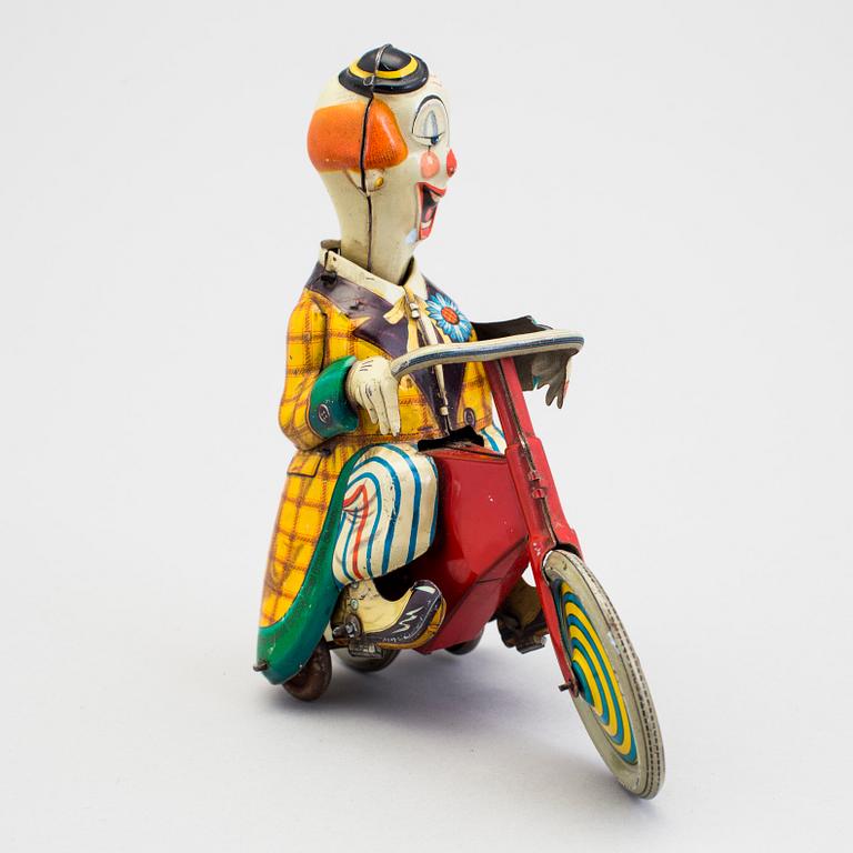 A tinplate Technofix bicycling clown Germany c. 1950.