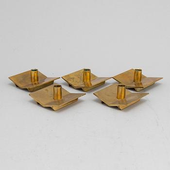 Pierre Forssell, a set of five brass 'Profil' candlesticks from Skultuna.