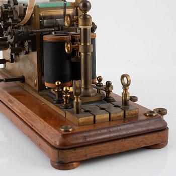 A telegraph from LM Ericsson, and a telegraph key from Digney Frères, early 20th century.