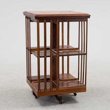 A swivel bookshelf veneered with mahogany from the second half of the 20th century.