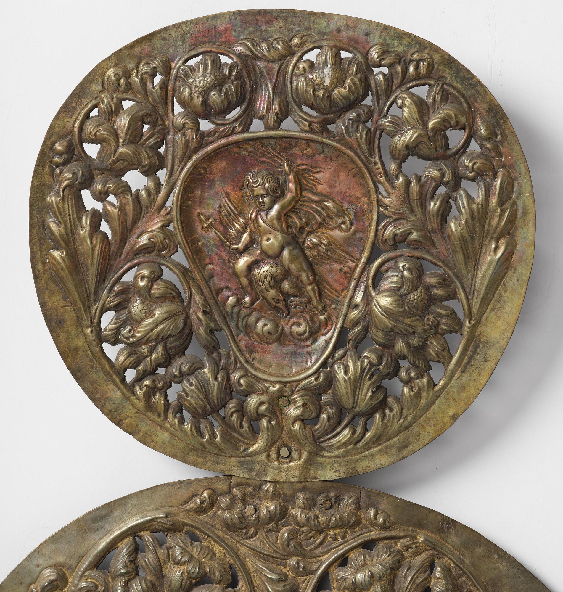 A set of four Swedish Baroque repoussé silvered brass reflector one-branch reflector plates, ca 1690-1700.