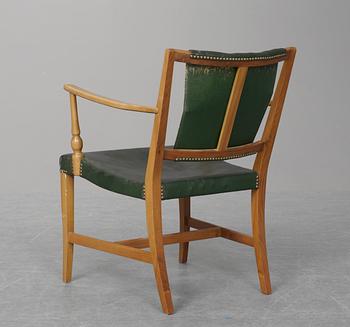 A Josef Frank mahogany and green leather easy chair, Firma Svenskt Tenn.