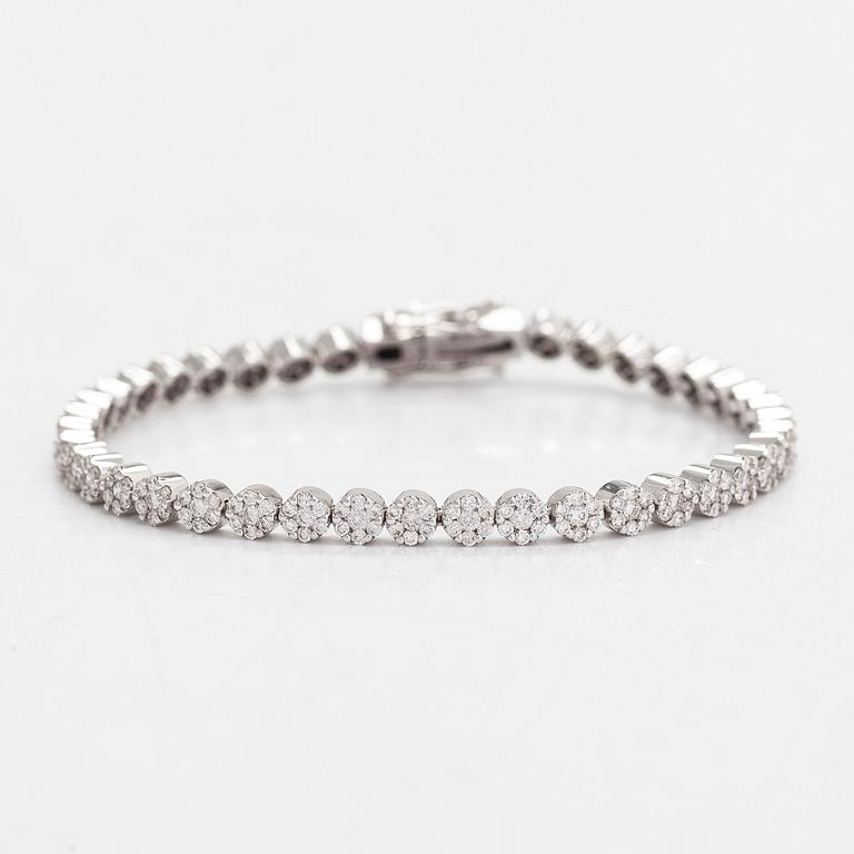 Tennisrannekoru, 18K valkokultaa, timantteja yht noin 3.44 ct. Suomalaiset leimat.