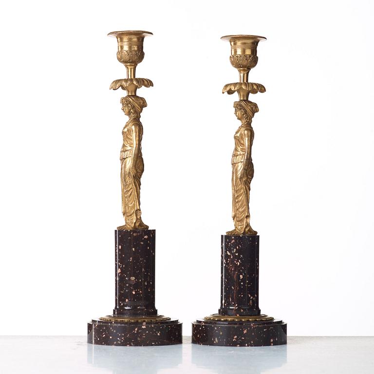 A pair of late Gustavian circa 1800 porphyry and bronze candlesticks.