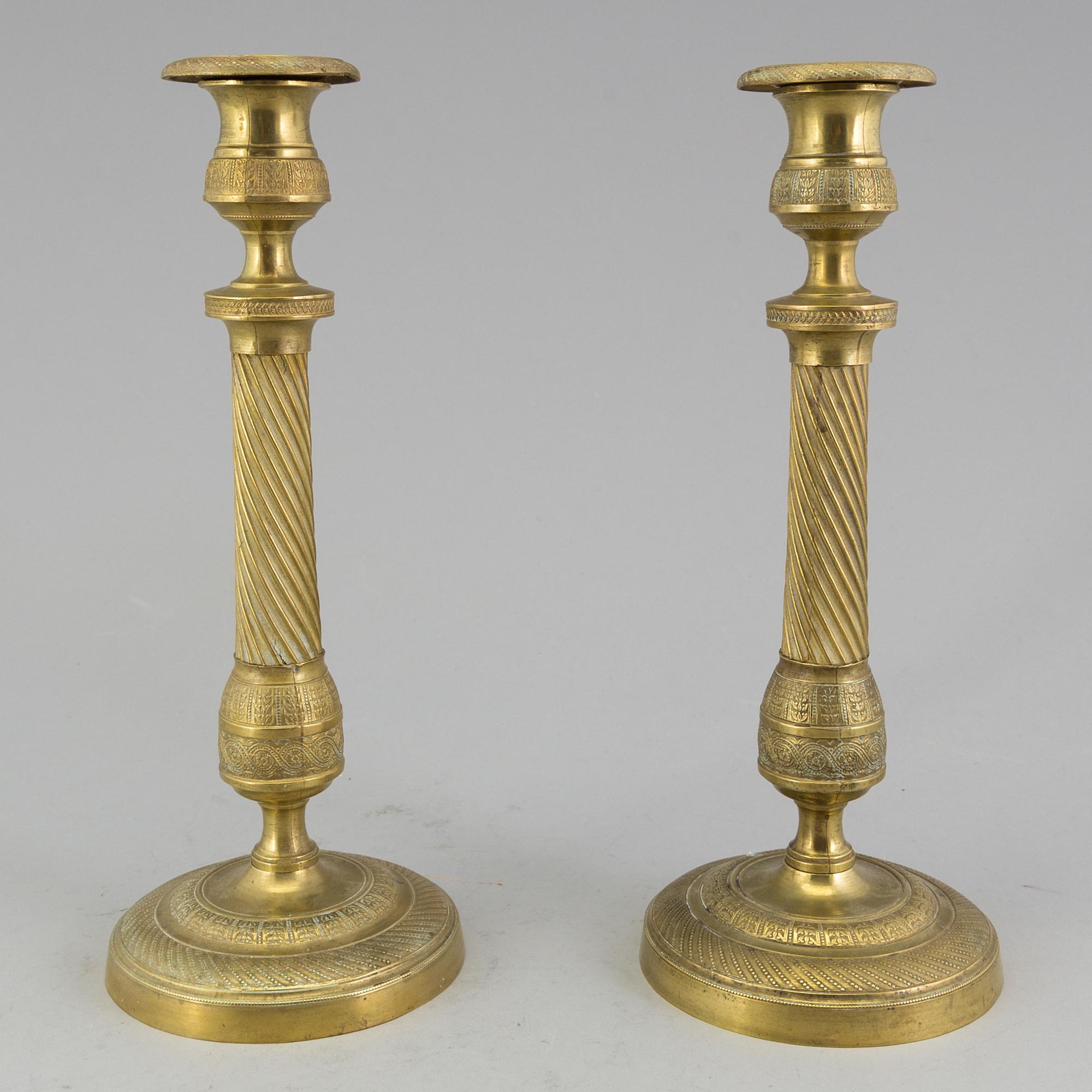 A pair of 'Empire' candlesticks, probably French.