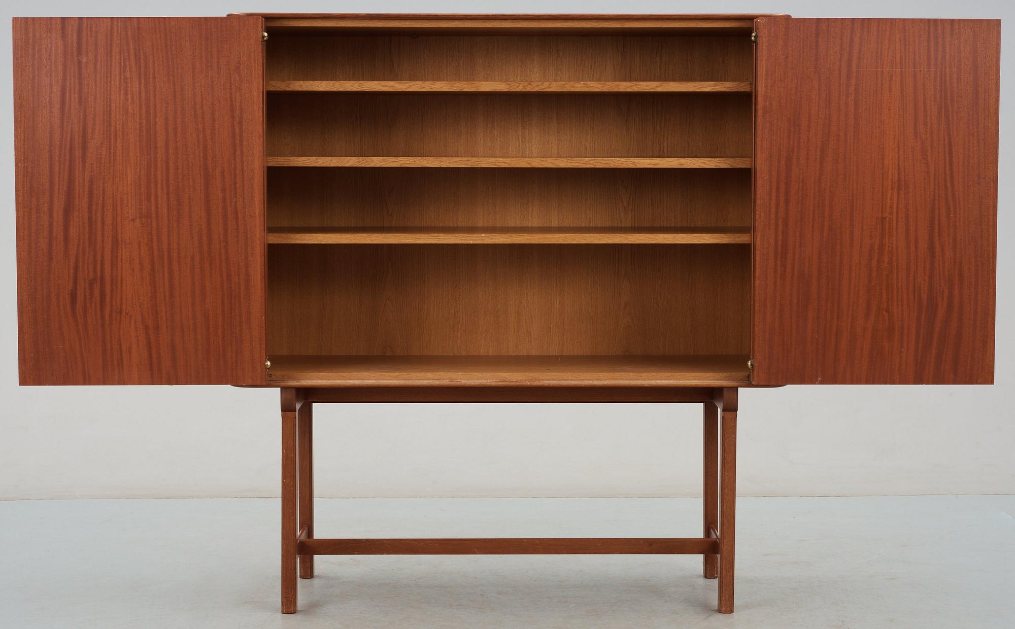 A Josef Frank mahogany cabinet, doors and sides covered in Frank's floral chintz fabric 'Fatima', Svenskt Tenn ca 1937.