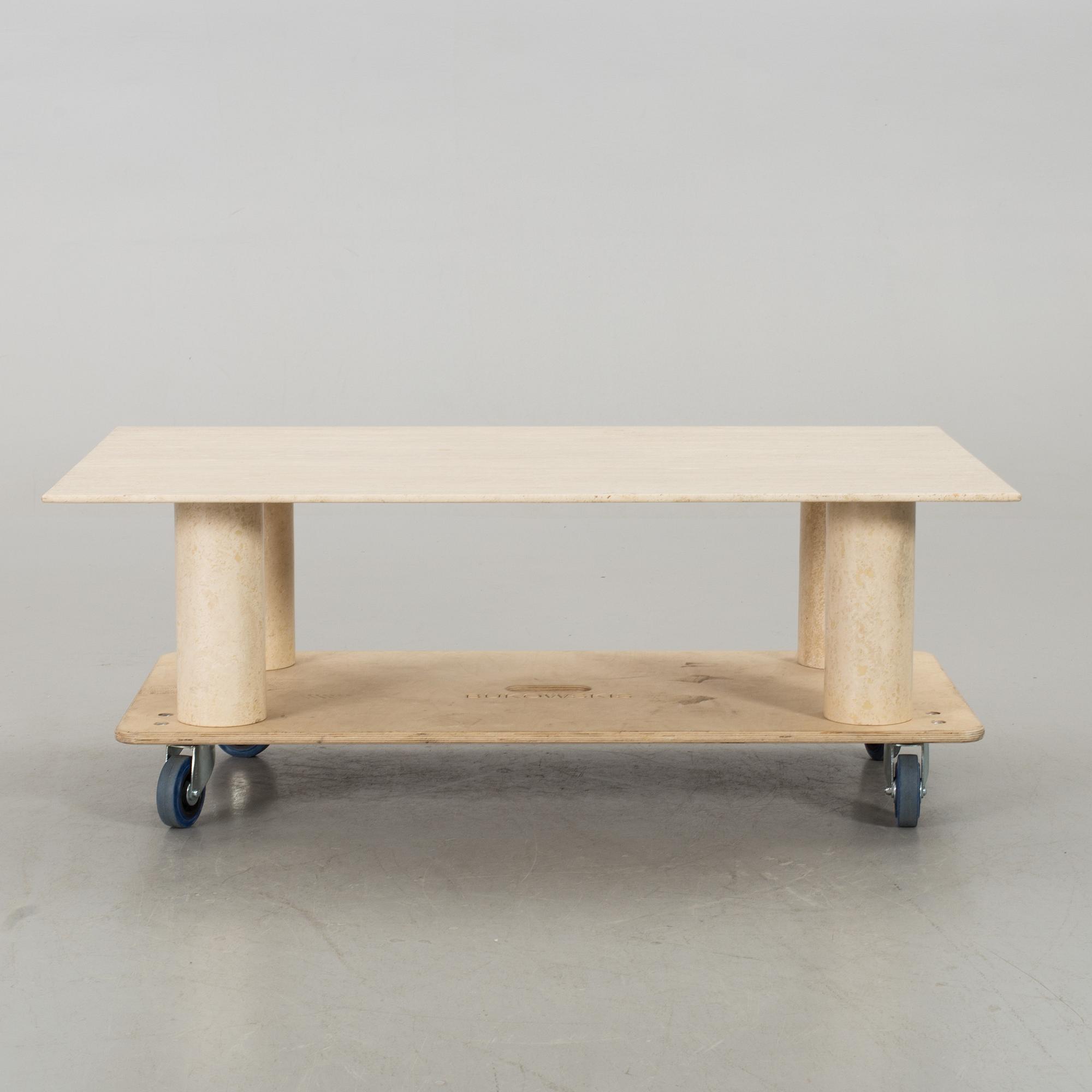 A TRAVERTINE SOFA TABLE.