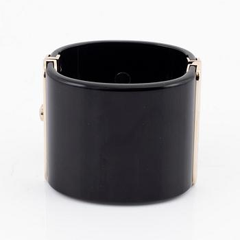 Chanel, a black acrylic cuff with pearls, 2019.