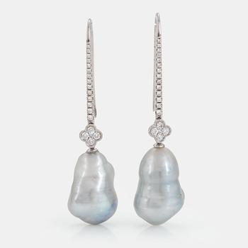 1115. A pair of cultured South Sea pearl earrings in 18K white gold set with round brilliant-cut diamonds.