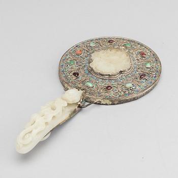 A Chinese silver mirror with carved nephrite placque and belt hook, early 20th Century.