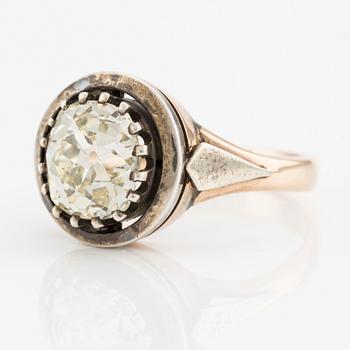 A 14K gold and silver ring with an old-cut diamond.