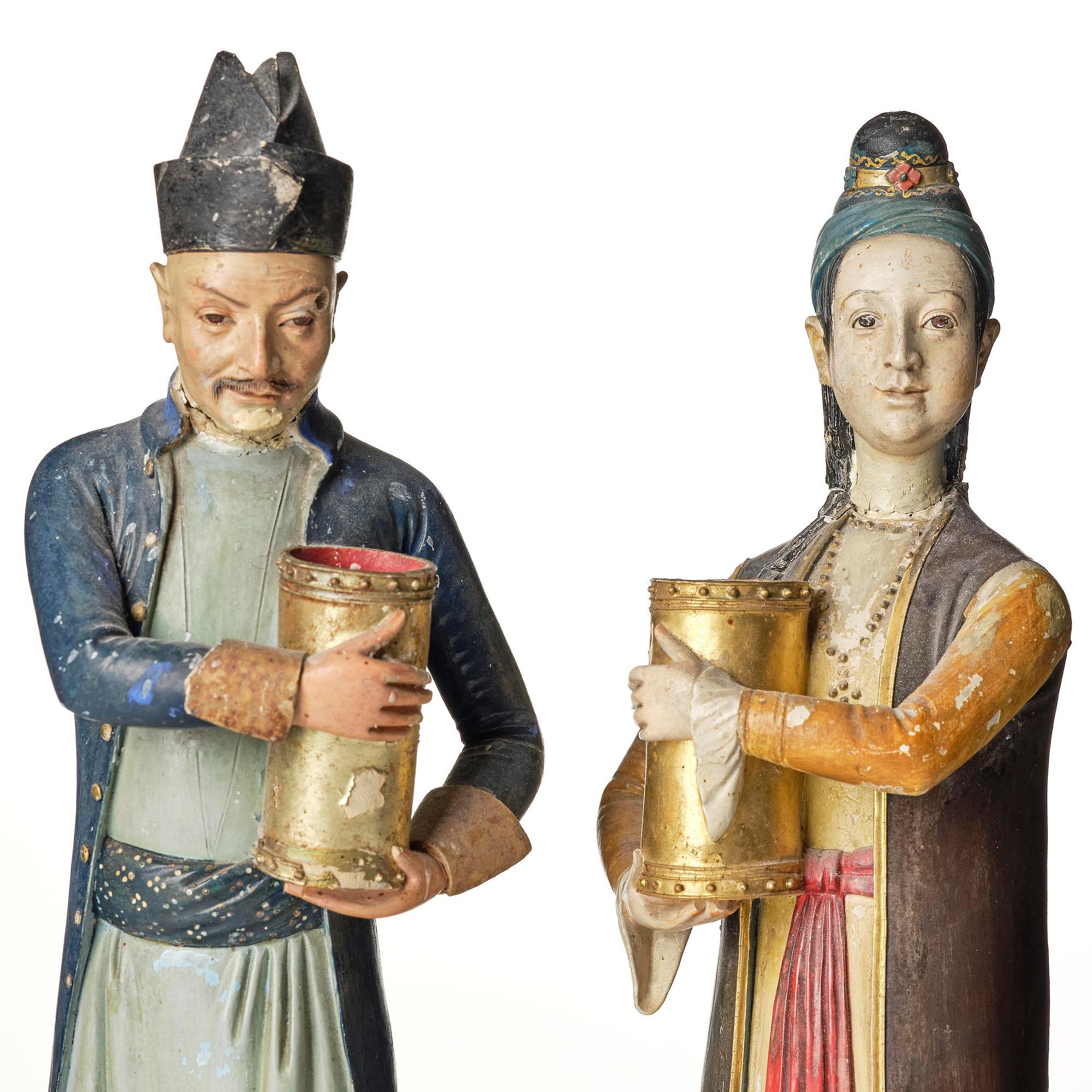 A pair of Chinoiserie figures of a Parsi tradesman and his wife, Qing dynasty, Canton, 19th century.