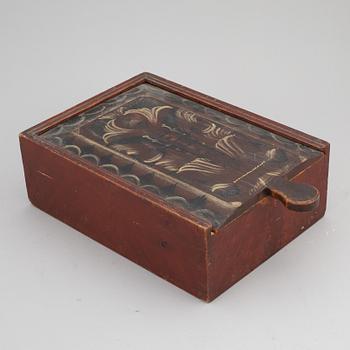 A swedish painted wooden box, Dalarna, marked 1879.