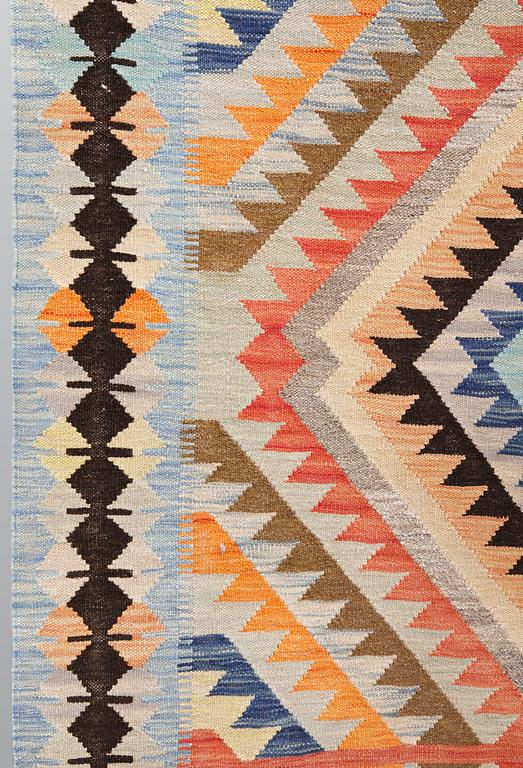 A kilim carpet, ca 386 x 151 cm.
