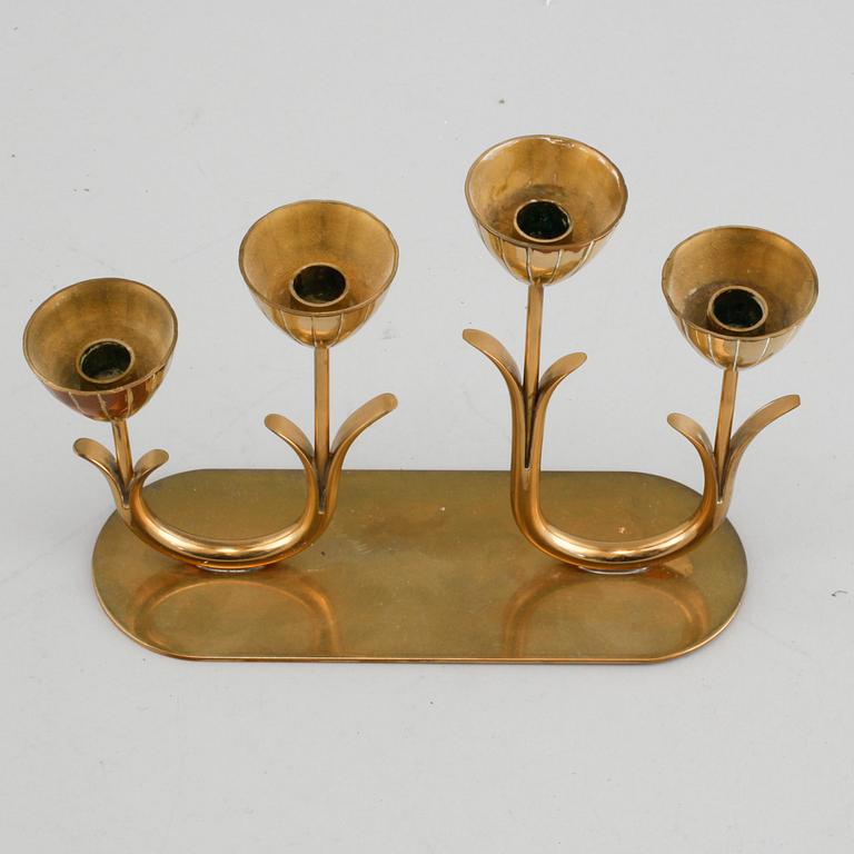 A candelabrum and one camdelstick by Gunnar Ander for Ystad Metall, 20th century.