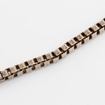 Silver necklace.