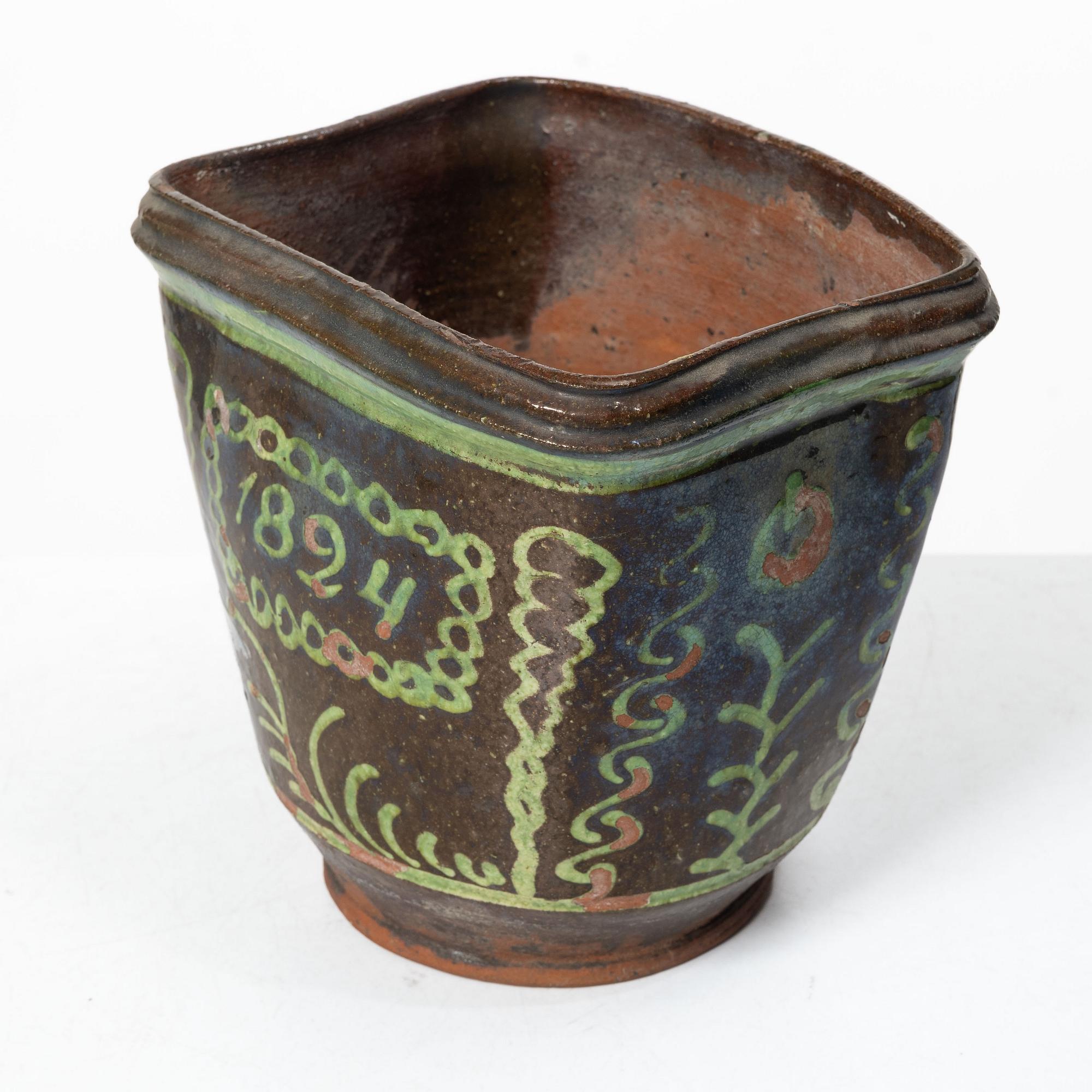 Stoneware planter and stand, dated 1824.