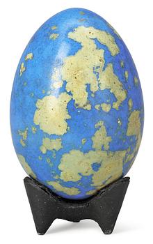 844. A Hans Hedberg faience egg on an iron base, Biot, France.
