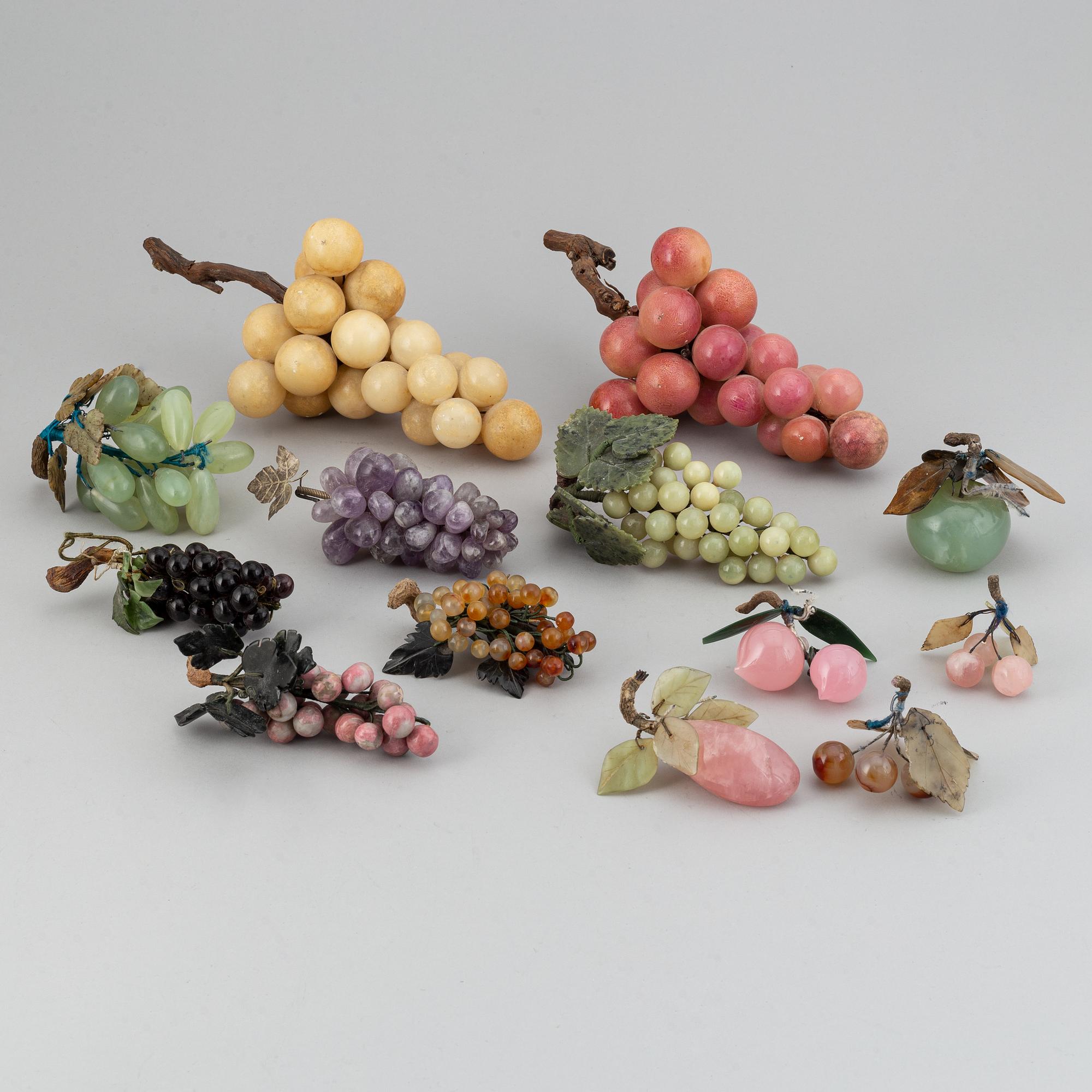 13 stone table decorations of grapes, 20th century.