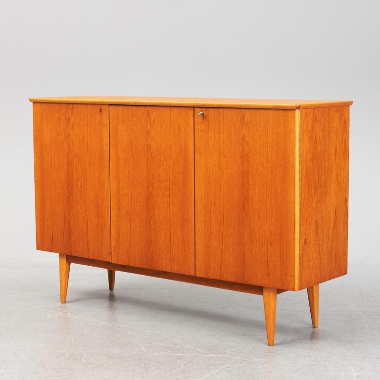 A mid 20th century teak veneered sideboard.
