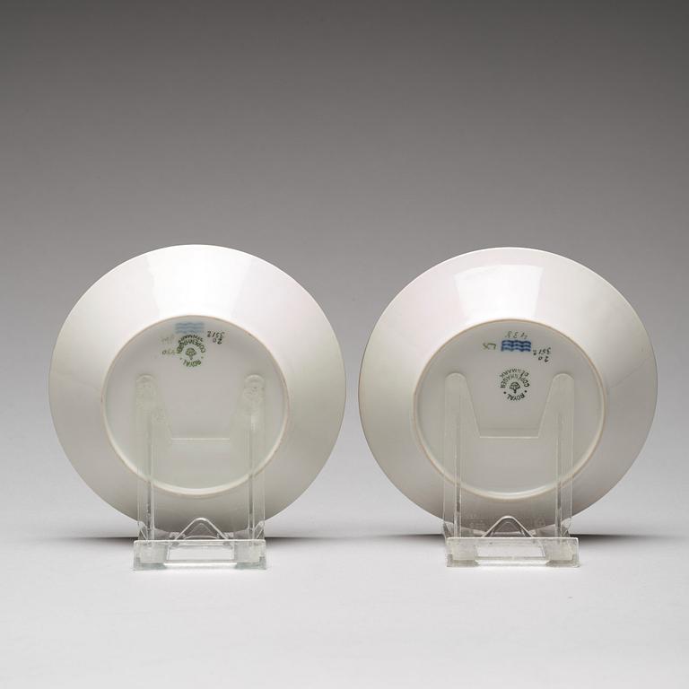 A pair of Royal Copenhagen "Flora Danica" coffee cups with stands, Denmark, 20th Century.