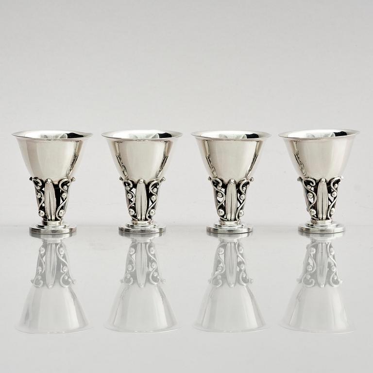 Evald Nielsen, four sterling silver beakers/cups on a foot, Denmark 20th century.