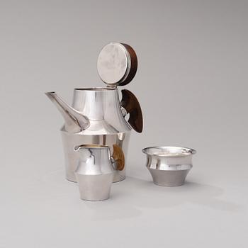 A coffee pot, sugar bowl and creamer signed TW. Silver 916, Kultakeskus, Hämeenlinna 1962 and -61.