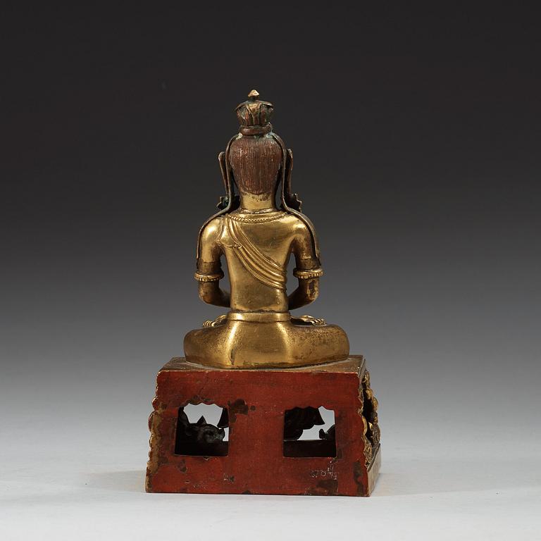 A gilt bronze figure of Amitayus, Qing dynasty with Qianlong mark and period, dating corresponding to 1780.