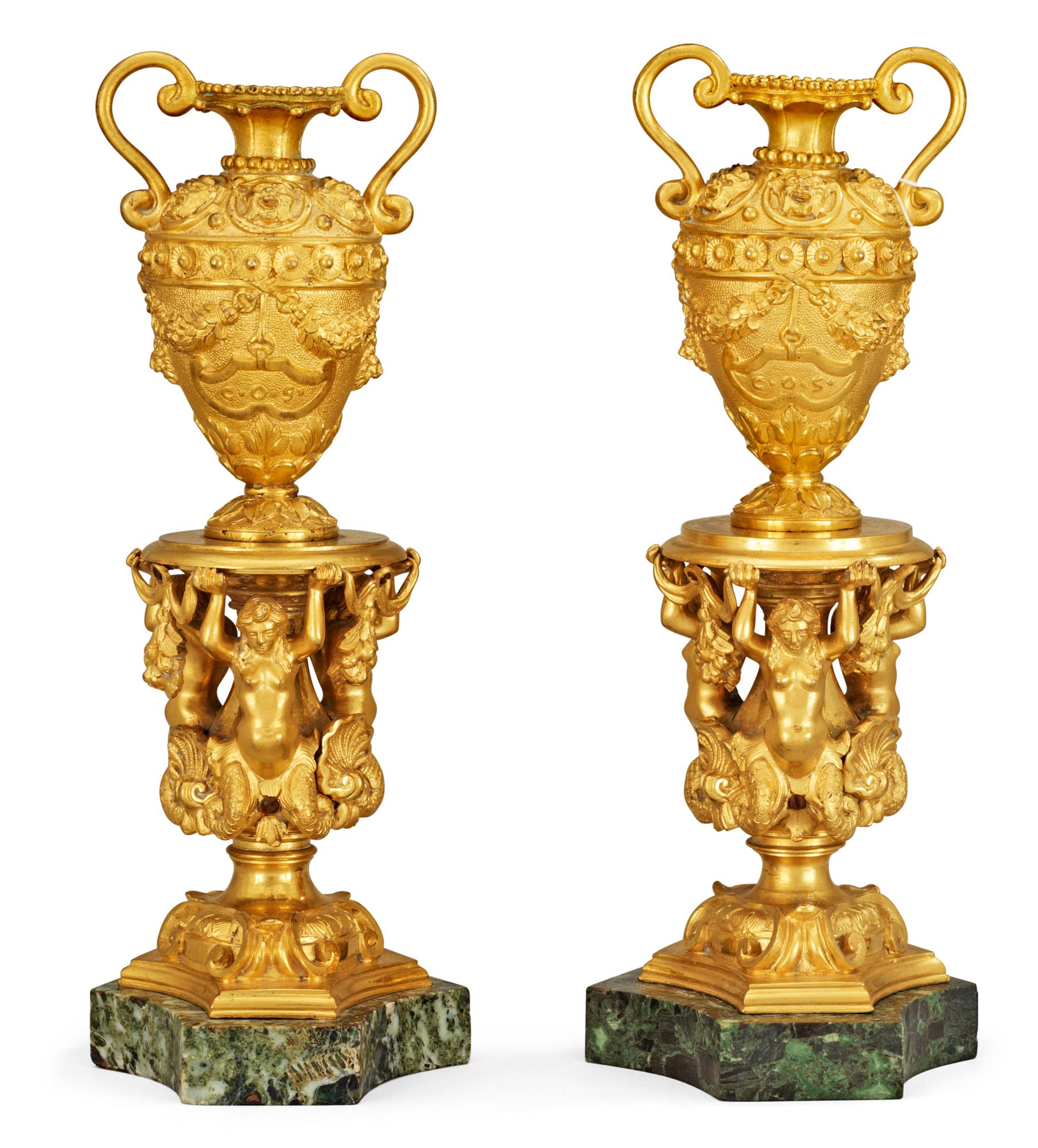 A pair of Italian 19th century gilt bronze and marble urns.
