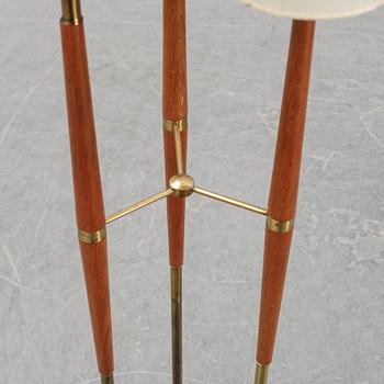 A wood and brass floor lamp from  Möllers Armaturer, Eskilstuna, mid 20th century.