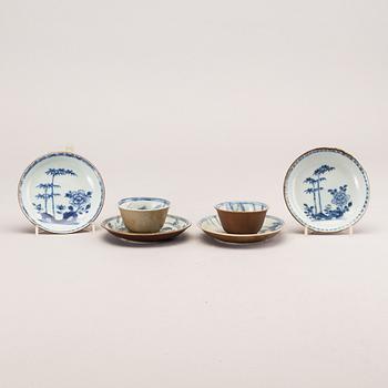 A set of two porcelain cups and saucers and two extra saucers, Qing dynasty, Kangxi (1662-1722).