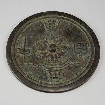A large bronze mirror, Ming dynasty or earlier.