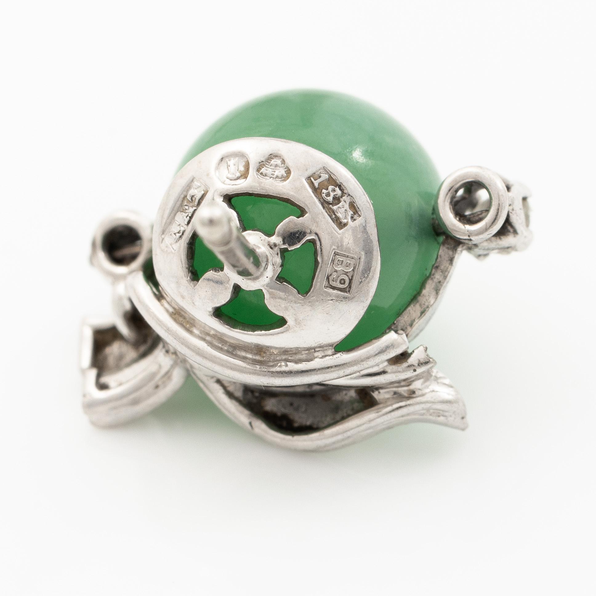 A pair of 18K white gold earrings with green quartz and rose-cut diamonds.