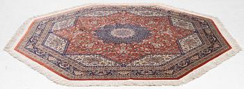 An Oktagonal  silk Qum rug, Central Persia, signed, c. 250 x 250 cm.