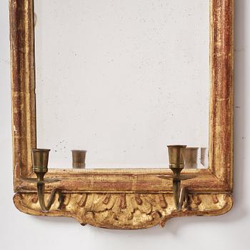 A pair of rococo giltwood two-branch girandoles, Stockholm, later part 18th century.