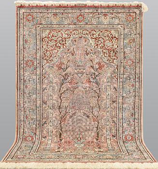 An oriental silk rug, approx. 155 x 93 cm.